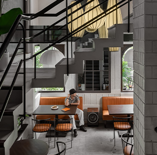 |The main facade with its rather subtle earthy palette and large glass facades.||||||||||||