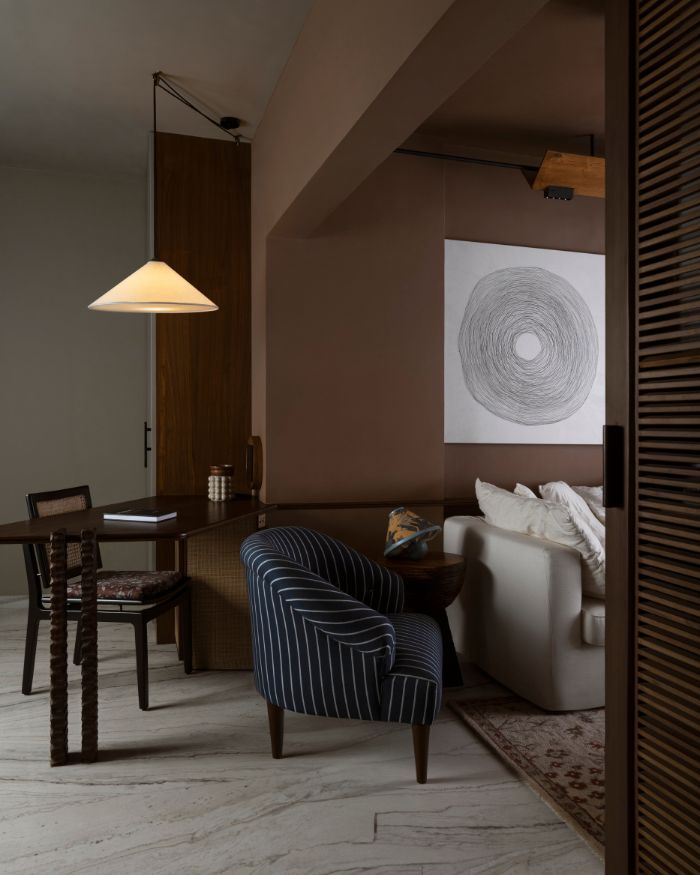 The study area in the Nishita Kamdar's Mumbai apartment. The lamp is by Olie Lighting and chair is from Gulmohar Lane; Photography by Yadnyesh Joshi
