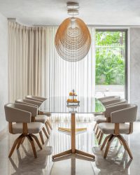 The Illan Suspension Chandelier by Zsuzsanna Horvath floats above the dining table like a piece of kinetic art; Photography by Anuja Kambli