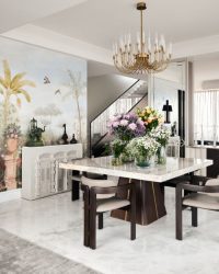 The dining area has furniture from Ochre At Home, lightning from Aavenue 48 & Lumiere and a handpainted wall mural by artist Jit Chowdhury; Photography by Gokull Rao Kadam