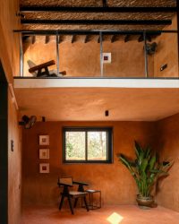 The double heightened volume of the space welcomes natural light that creates patterns through the day; Photography by Vivek Eadara