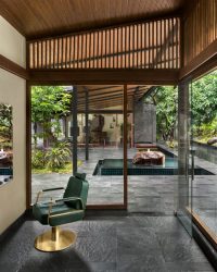 View from the salon with the floating rock and reception area in the background; Photography by Kunal Bhatia