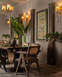 The dining area features one of the homeowners most prized
possessions—a painting from Bali; Photography by Tarang Goyal