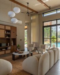 The sofa in the living area uses boucle fabric and the space is furnished artefacts and antiques sourced countrywide; Photography by Rohit Ganguly 